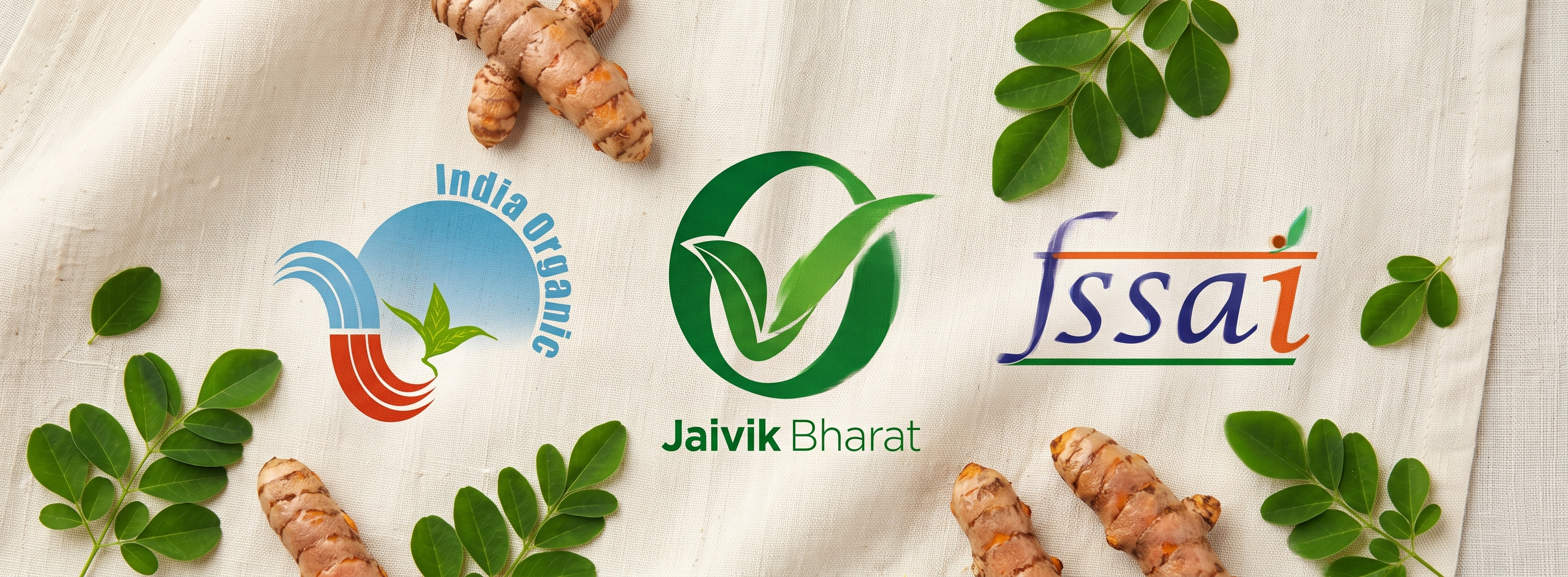 India Organic, Jaivik Bharat and FSSAI certification badges with turmeric roots